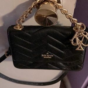 Reselling a previous owned Blk Kate spade handle/belt bag w gold charms hardware